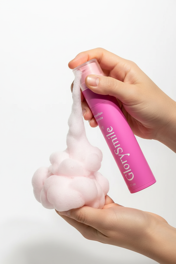 Hands using colorful foam dispenser