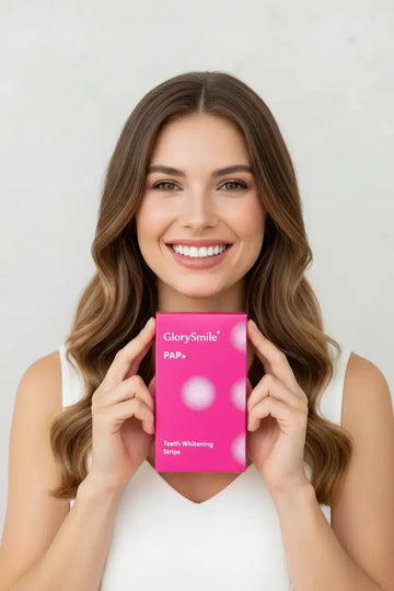 Woman holding PAP+ with smile